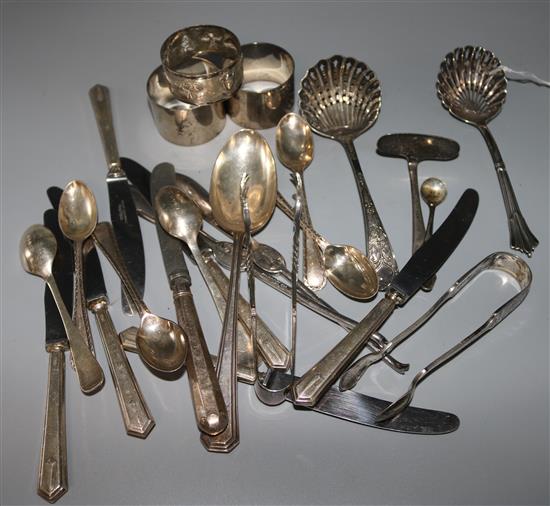 Three silver napkin rings and a small quantity of silver and silver plated cutlery including a set of teaspoons.